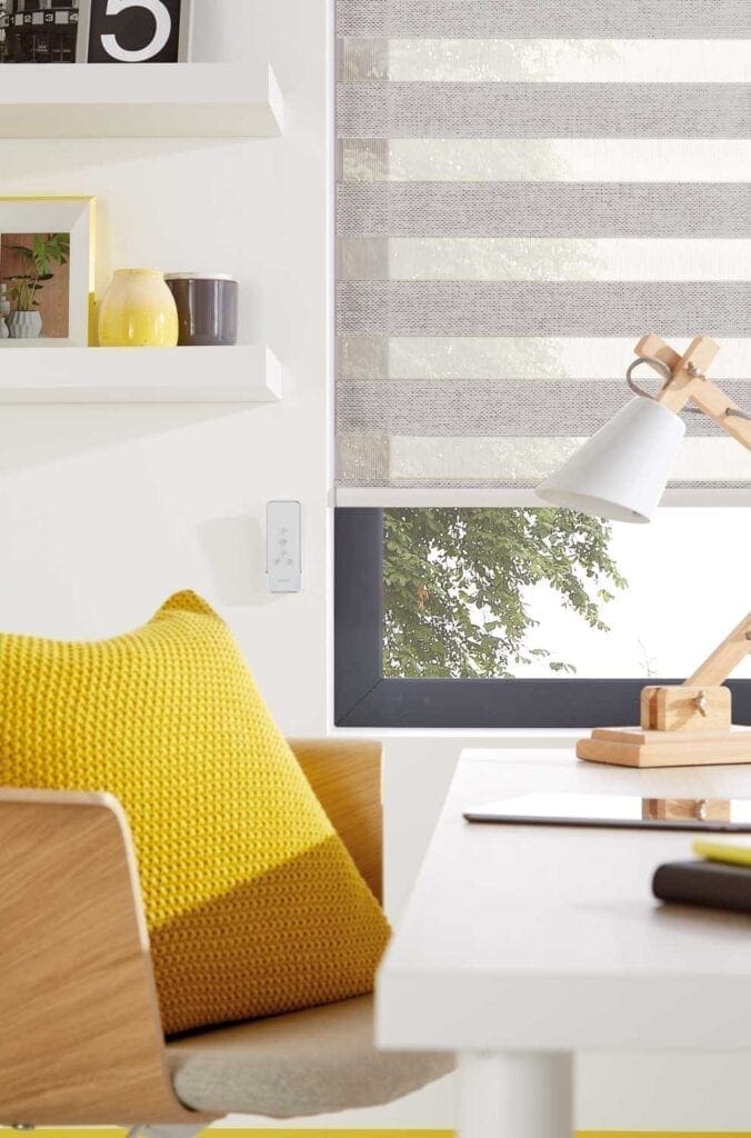brown woven chairs with yellow cushions in a well lit room