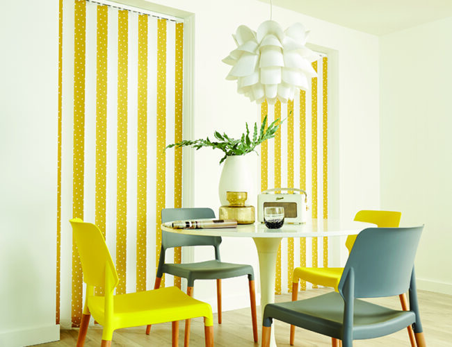 Bold vertical blinds for living room windows in a modern dining area