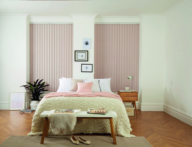 Soft pink vertical blinds for bedroom windows in modern interior