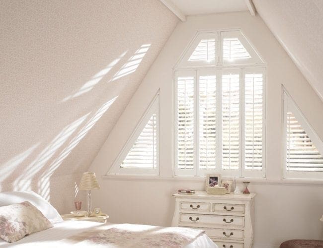 Shutter blinds for angled bedroom windows in a loft space