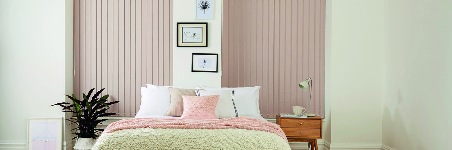 Pink vertical blinds for bedroom windows in modern UK home
