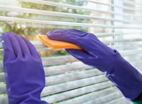 hands-in-rubber-gloves-cleaning-blinds