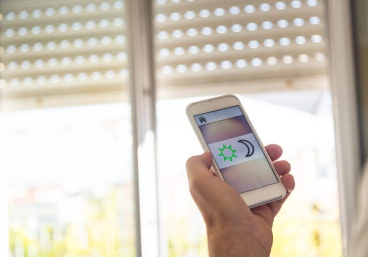 Man Controlling Blinds With His Phone