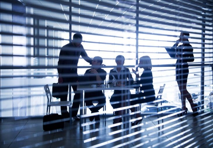 Business-people-in-office-with-blinds