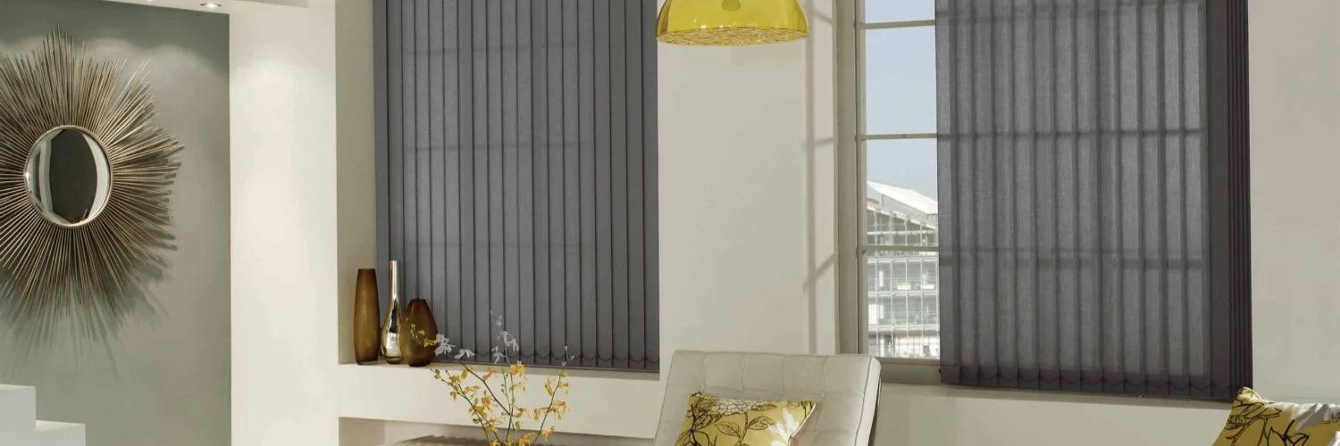 Vertical blinds in a modern UK living room with grey fabric