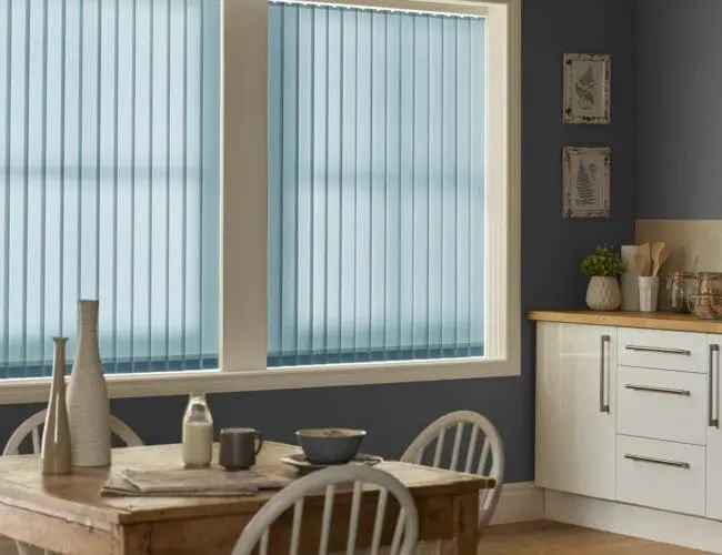 blue vertical blinds in a modern kitchen and dining area