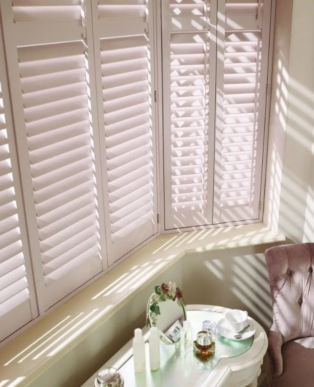 White plantation shutters in Alwoodley bathroom providing privacy and light control