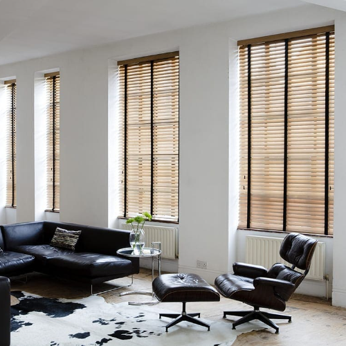 Venetian blinds in living room with wooden slats providing light control and privacy