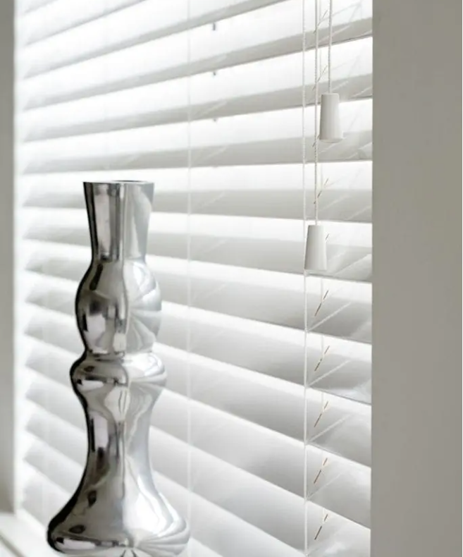 White venetian blinds in Outwood offering precise light control and privacy