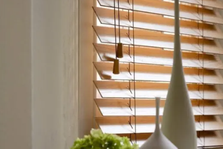 Close-up of wooden blinds with adjustable slats